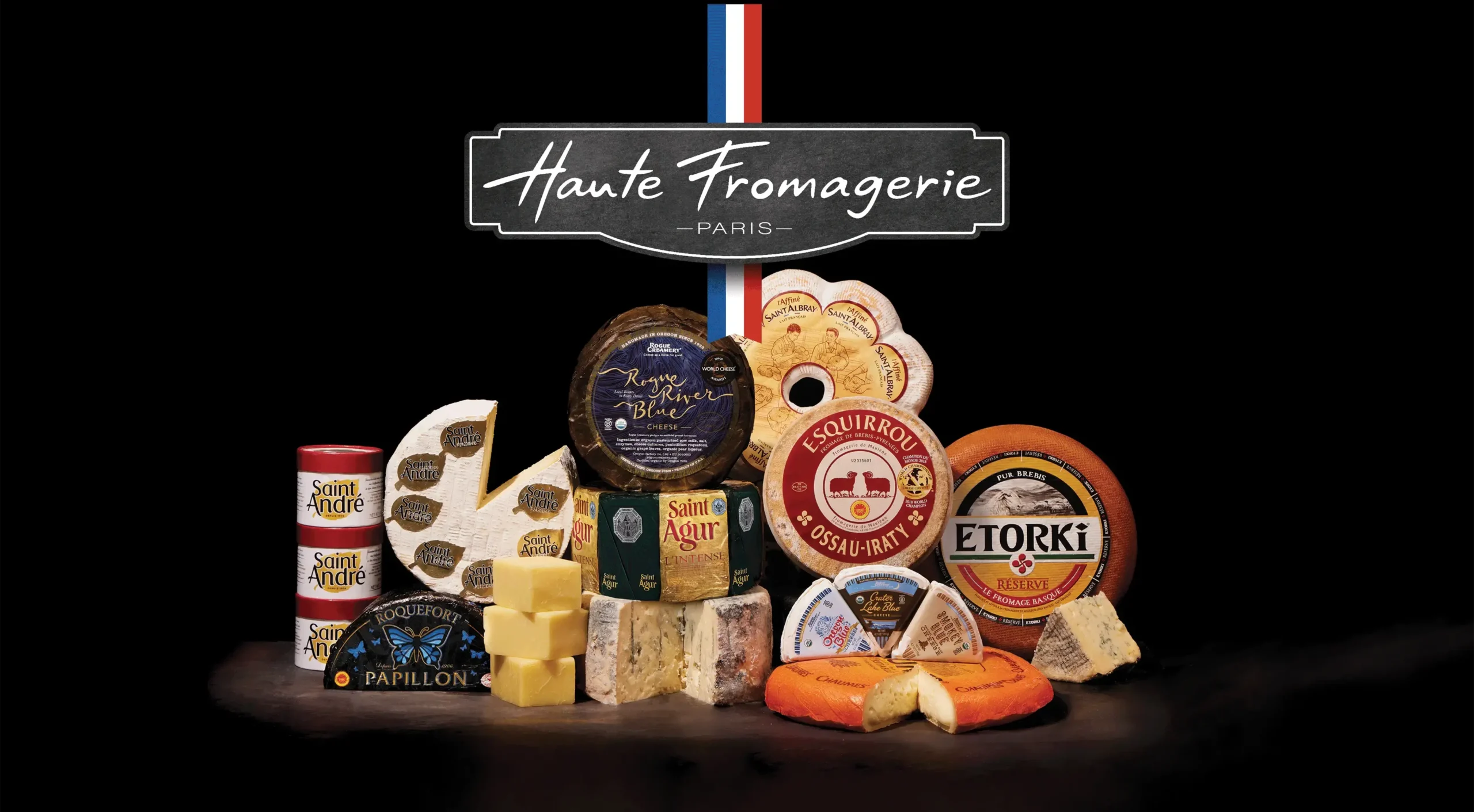 Assortment of French cheeses and charcuterie products displayed under "Haute Fromagerie Paris" branding with French flag.