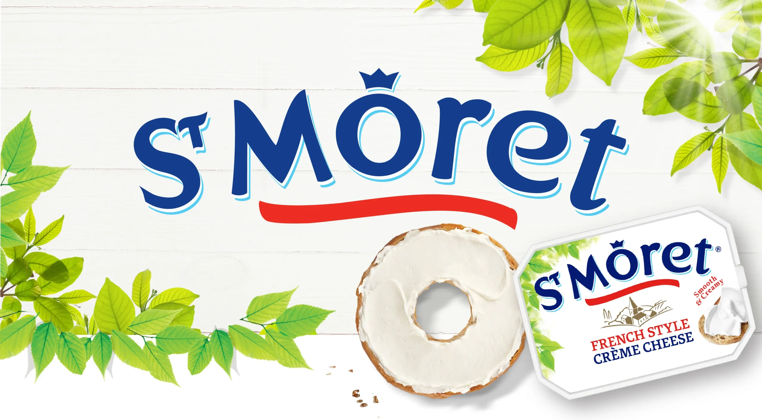 Smöret dairy brand logo with blue text and red underline, featuring a coconut half and French-style creme cheese product packaging surrounded by green leaves.